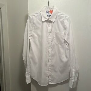 Boys white dress shirt barely worn for 2 hours. Dry cleaned Excellent condition